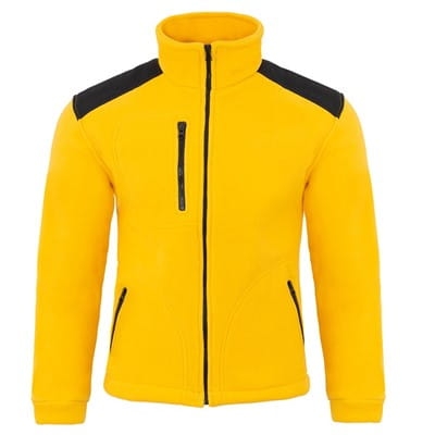 Keltainen fleece-takki mustilla yksityiskohdilla.
